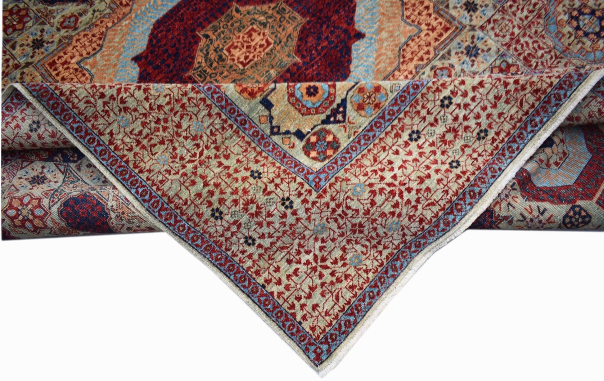 A handwoven Afghan Balkh rug featuring a detailed Mamluk medallion pattern in red and blue tones.