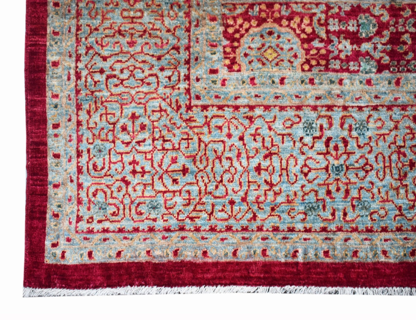 A handmade Afghan Balkh rug featuring a detailed Mamluk pattern in red and blue wool.