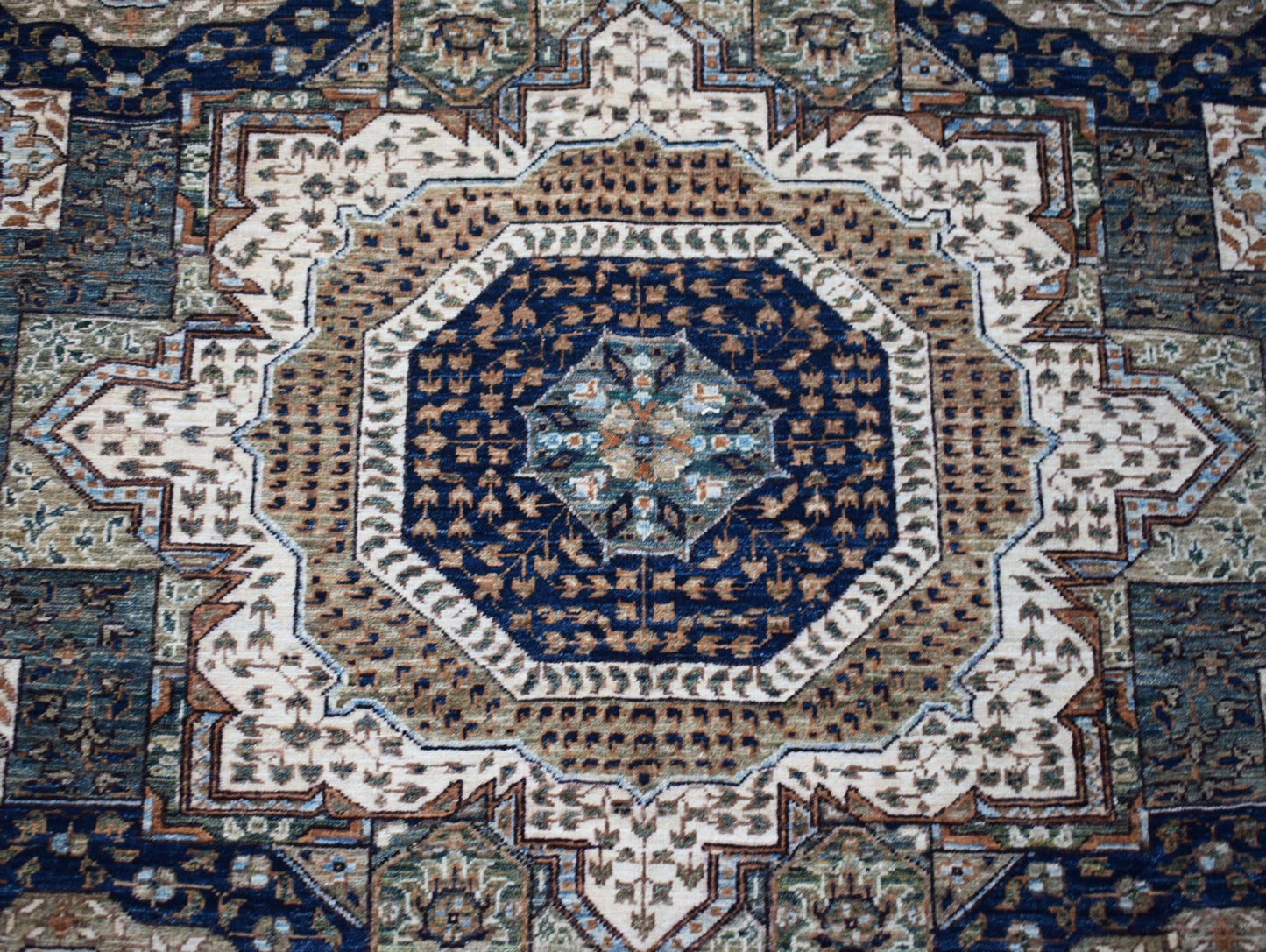 A handwoven Afghan Balkh rug featuring a detailed blue and tan Mamluk medallion pattern.