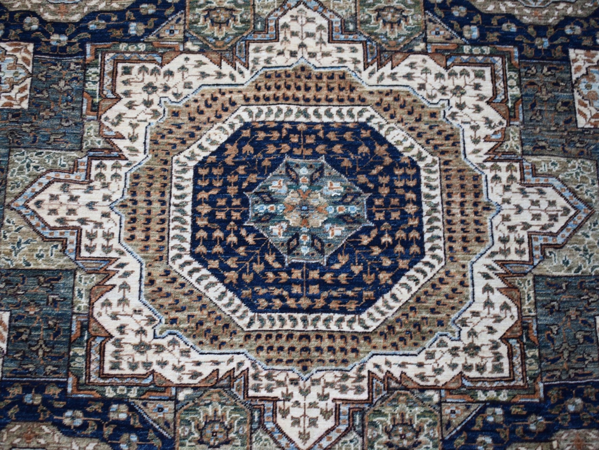 A handwoven Afghan Balkh rug featuring a detailed blue and tan Mamluk medallion pattern.