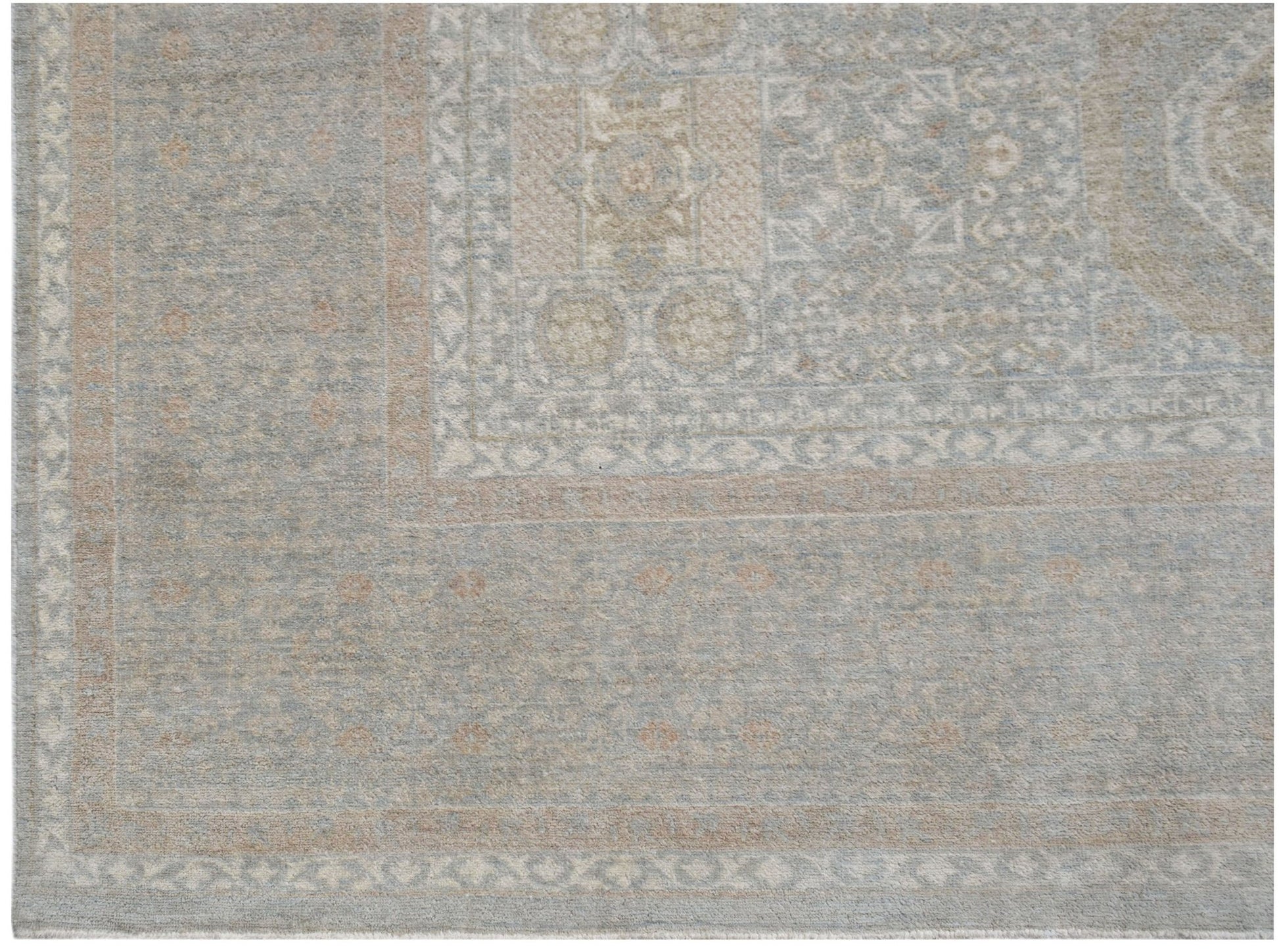 A handwoven Afghan Balkh rug featuring a traditional geometric pattern in soft blue and beige tones.