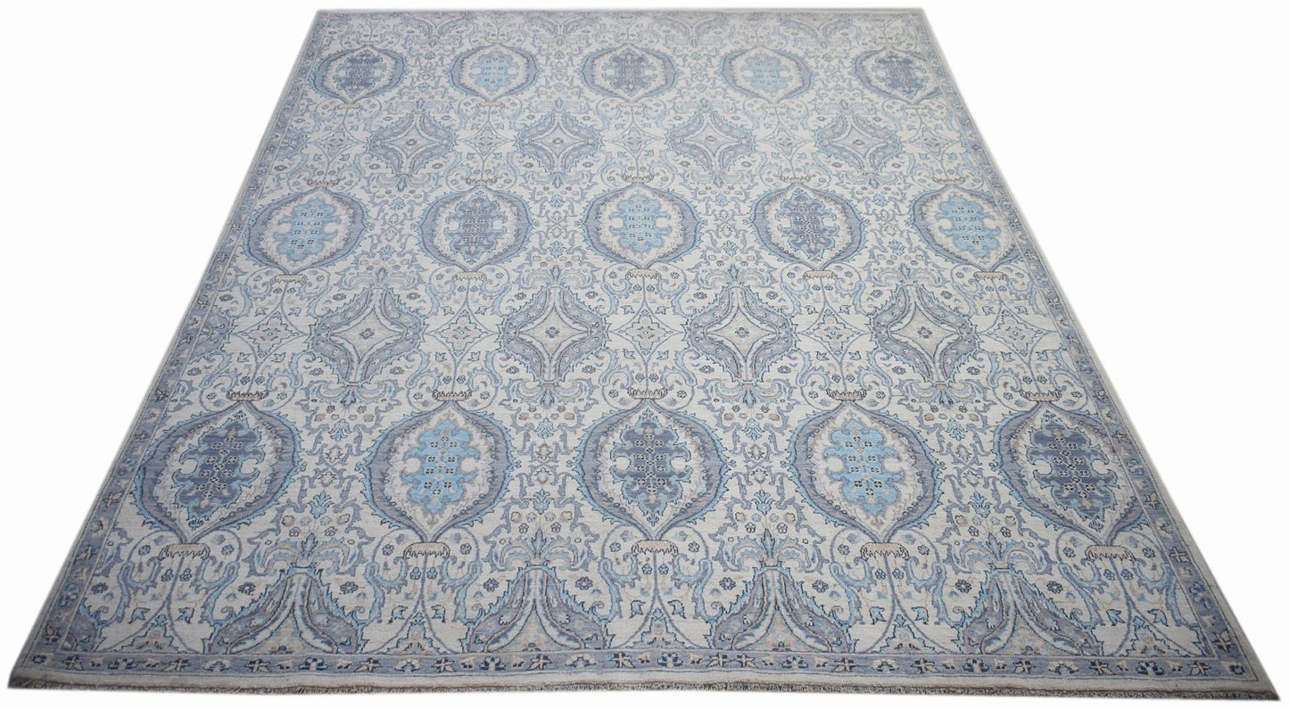 Handwoven Afghan Balkh rug featuring a traditional blue and cream floral medallion pattern.