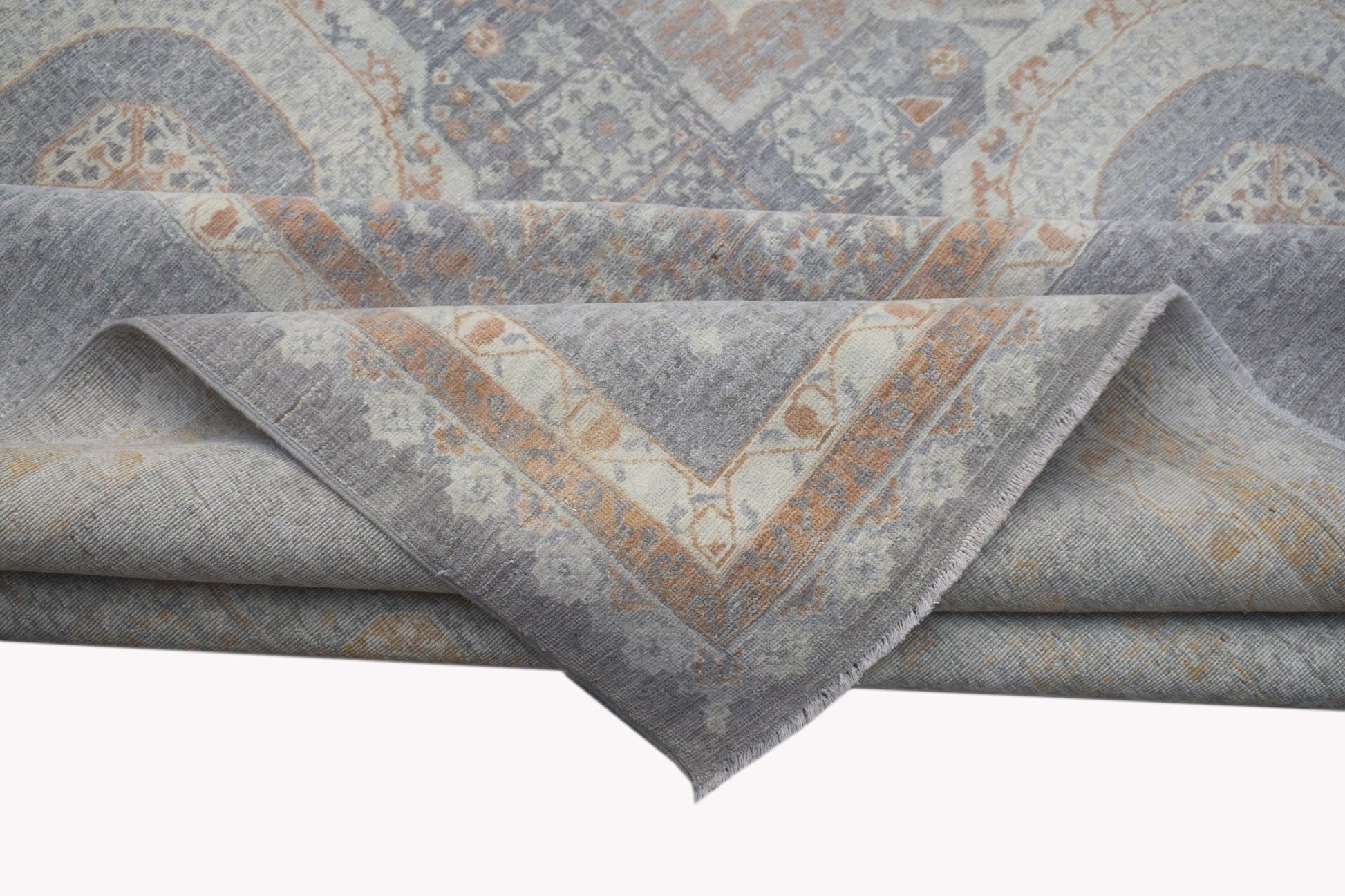 A handwoven Afghan Balkh rug featuring a traditional Mamluk pattern in grey and soft orange tones.