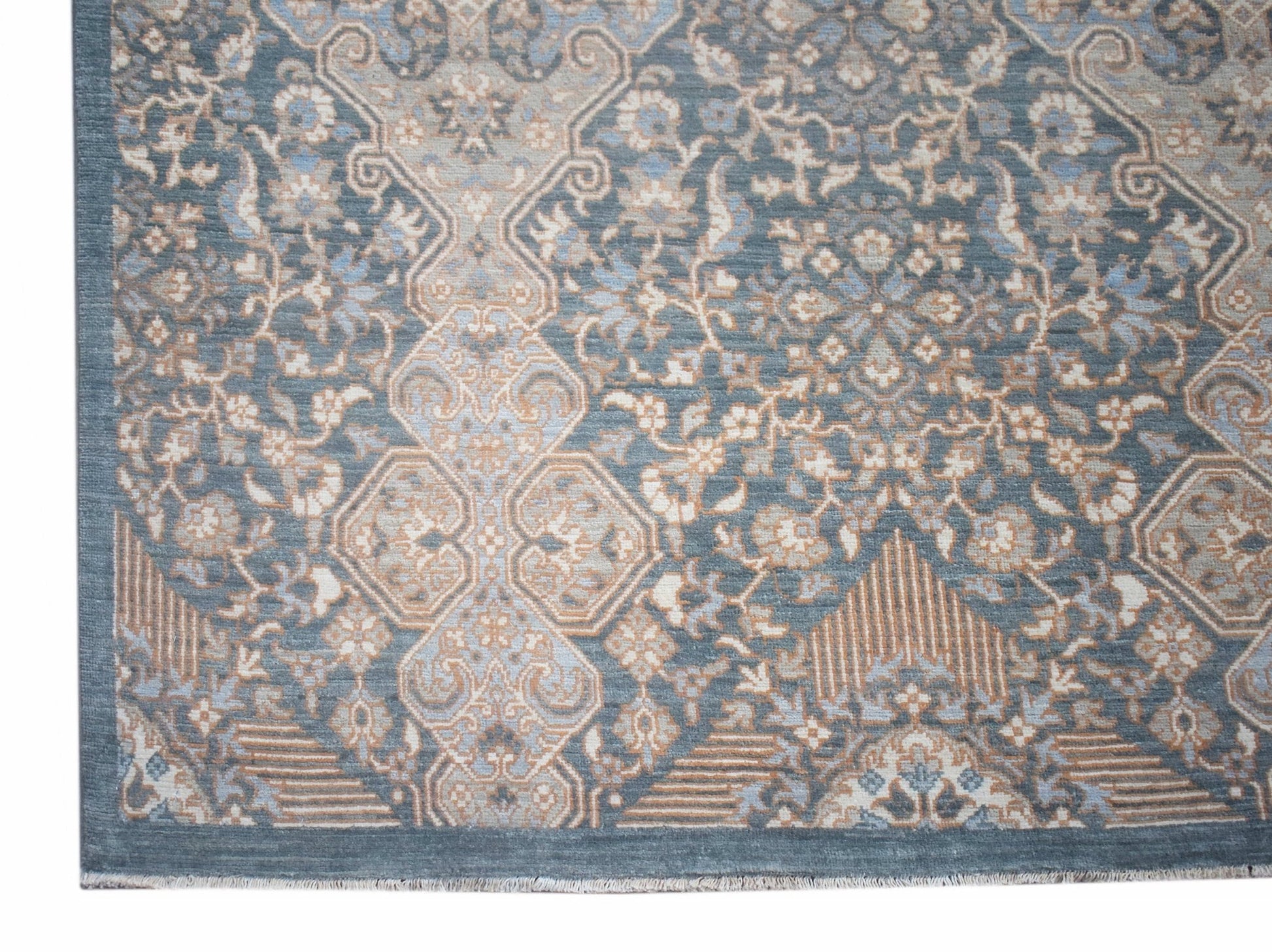 Handwoven Afghan Balkh rug featuring a traditional floral pattern in shades of blue and beige.