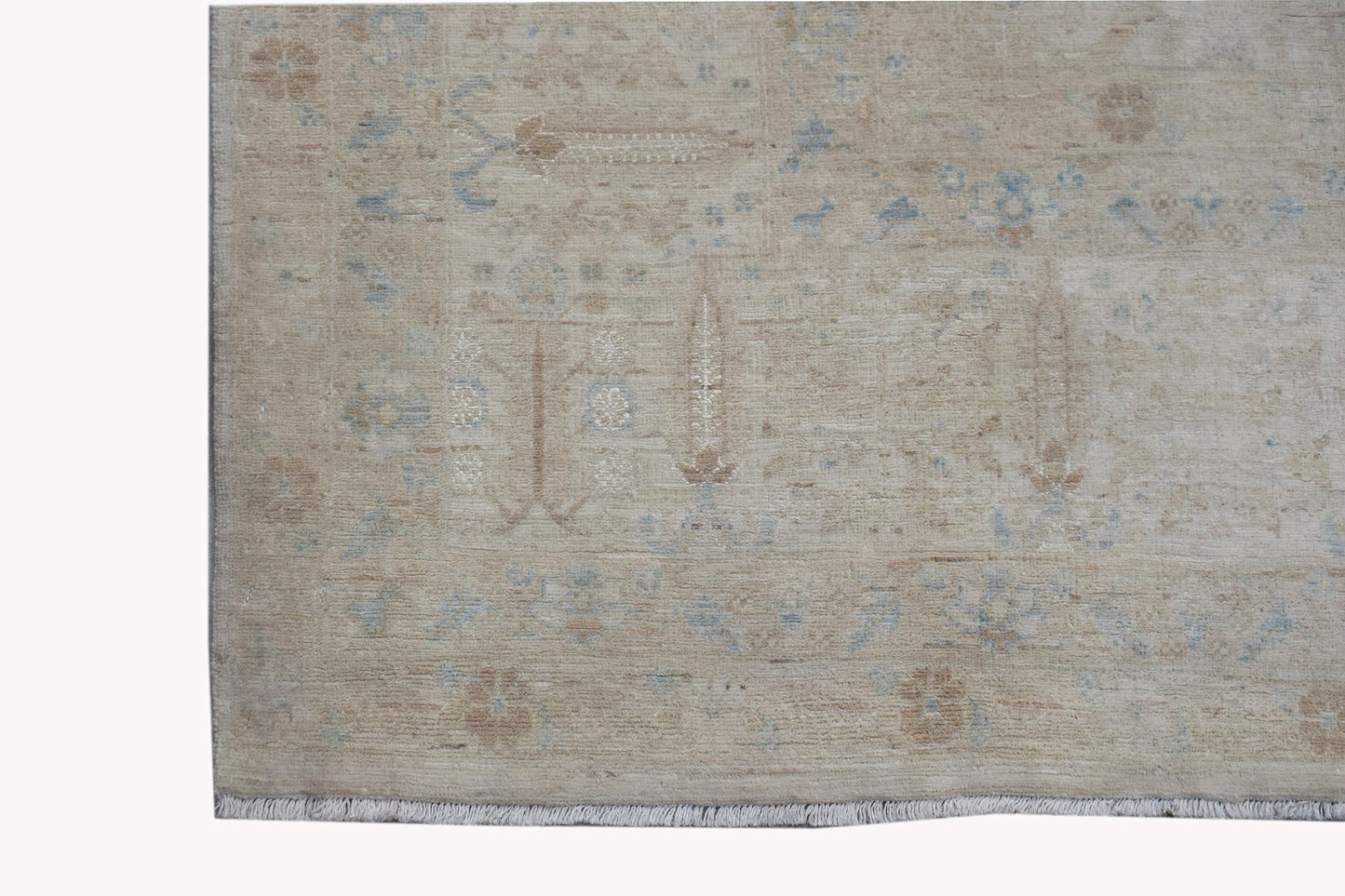 A handwoven Afghan Balkh rug featuring a traditional Chobi pattern in soft beige and blue tones.