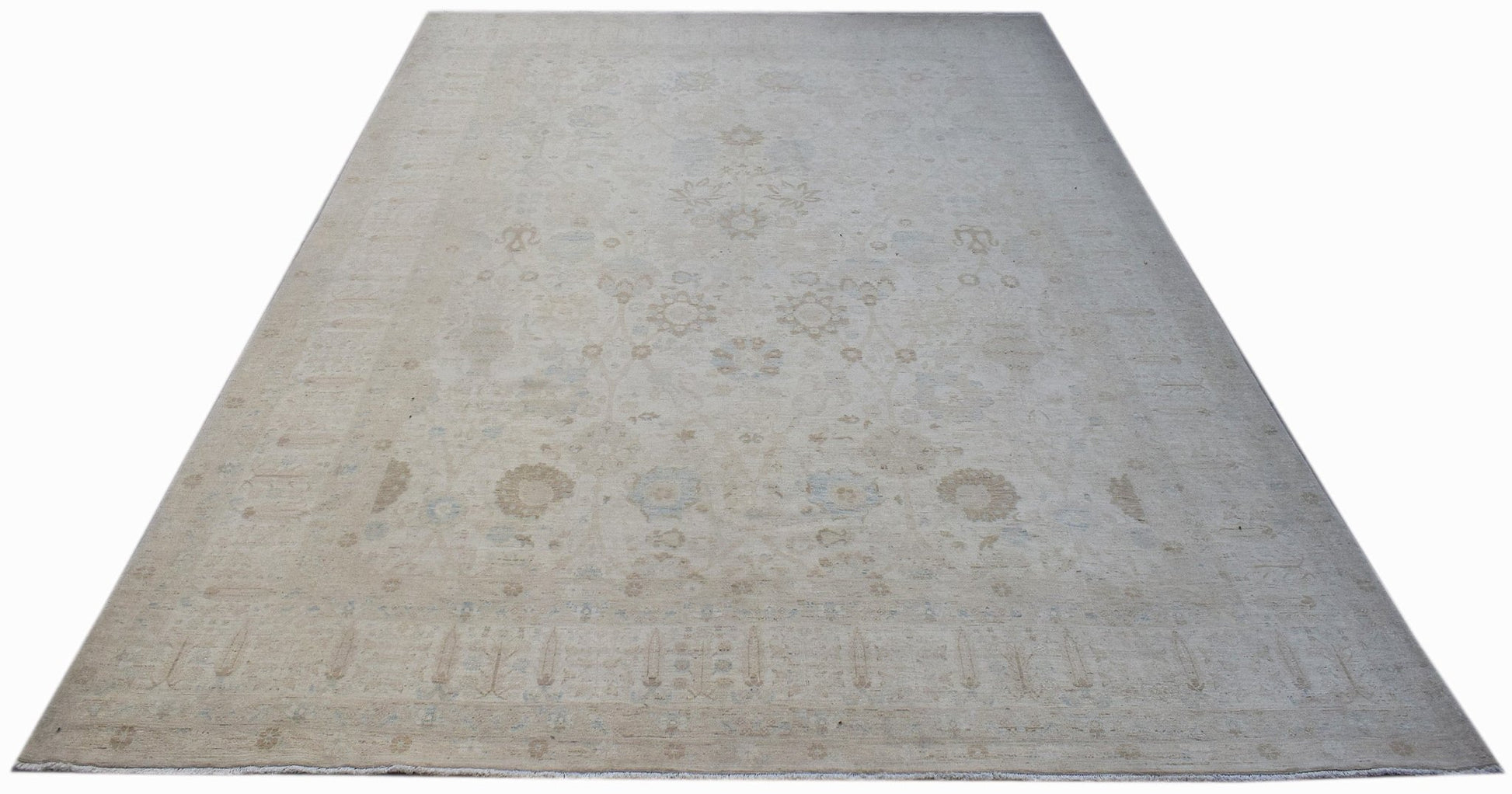 A handmade Afghan Balkh rug featuring a subtle, light-toned floral pattern on a wool pile.