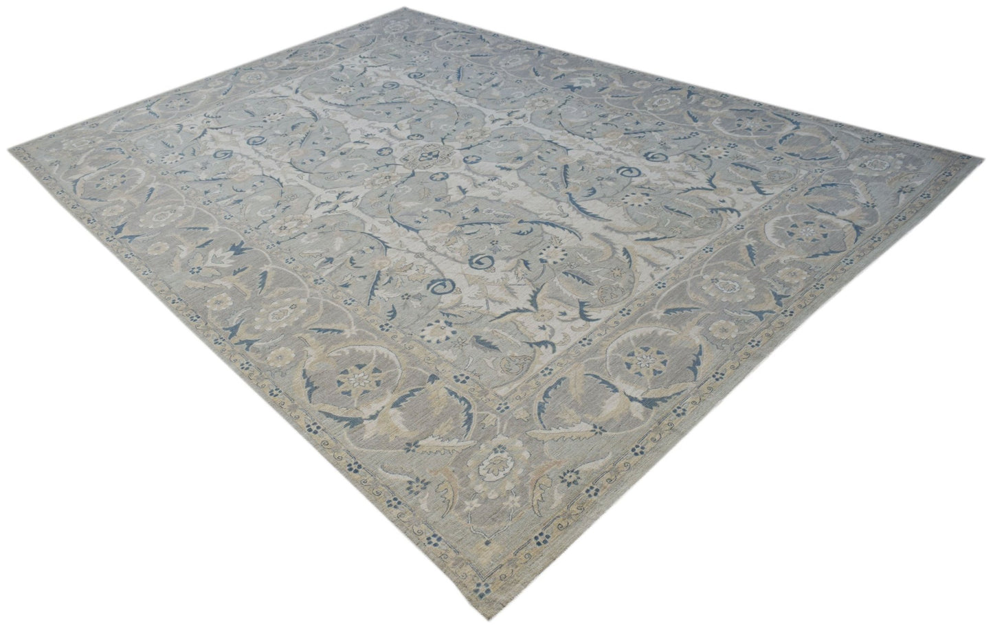 A rectangular Afghan Balkh rug featuring a traditional floral pattern in soft blue and beige tones.