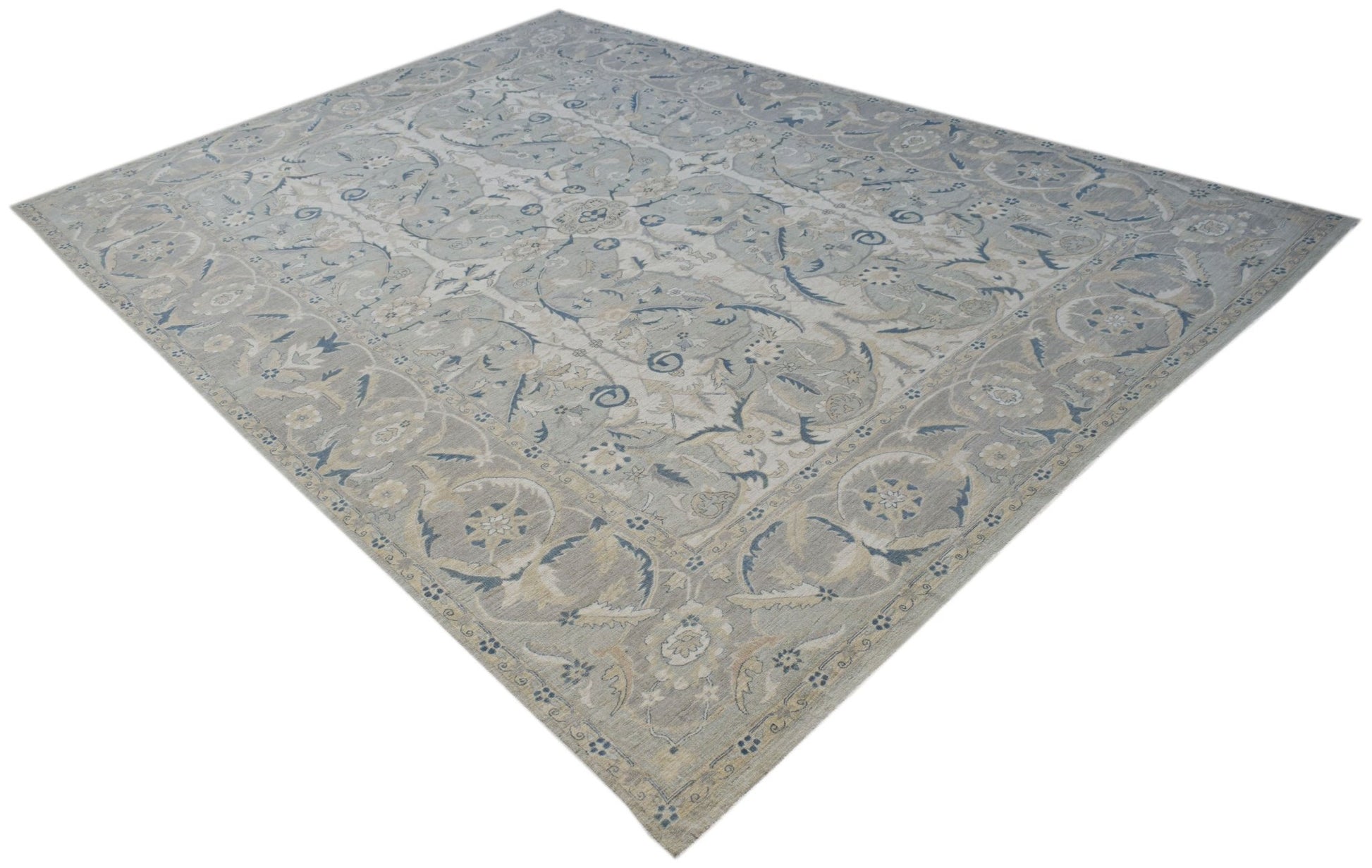 A rectangular Afghan Balkh rug featuring a traditional floral pattern in soft blue and beige tones.
