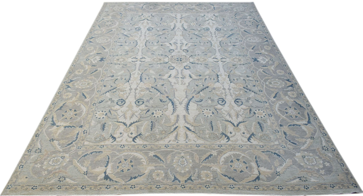 A rectangular Afghan Balkh rug featuring a traditional floral pattern in soft blue and beige tones.