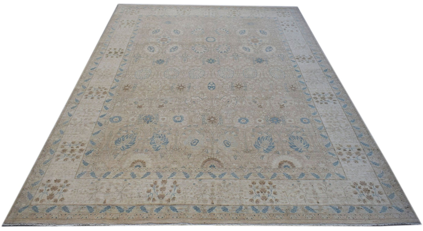 A handwoven Afghan Balkh rug featuring a traditional floral pattern in soft beige and blue tones.