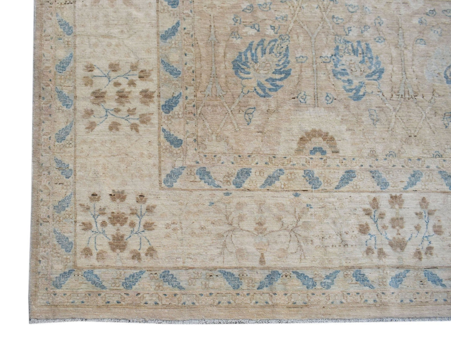 A handwoven Afghan Balkh rug featuring a traditional floral pattern in soft blue and beige tones.