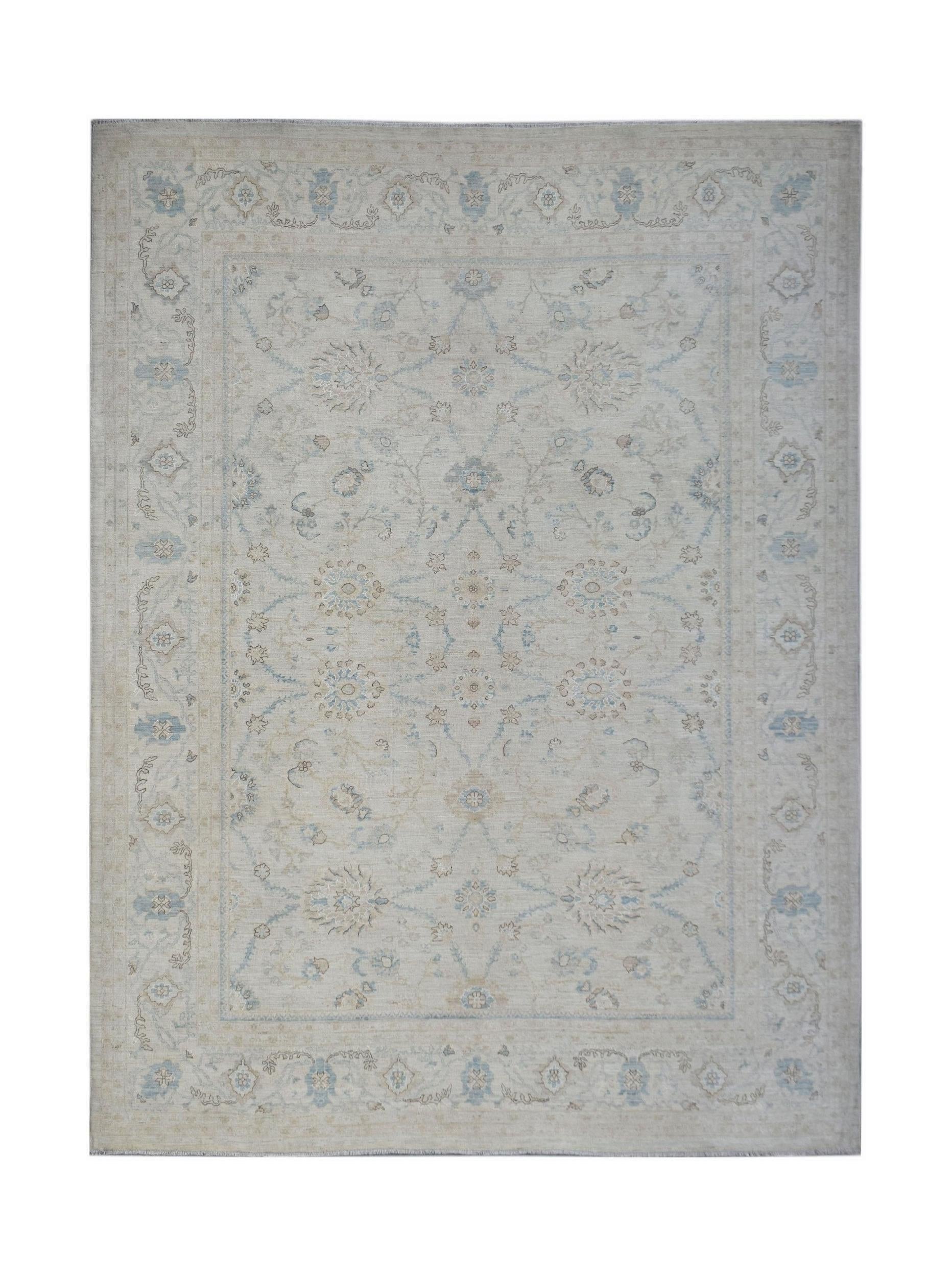 An Afghan Balkh rug featuring a traditional floral pattern in soft blue and beige tones.