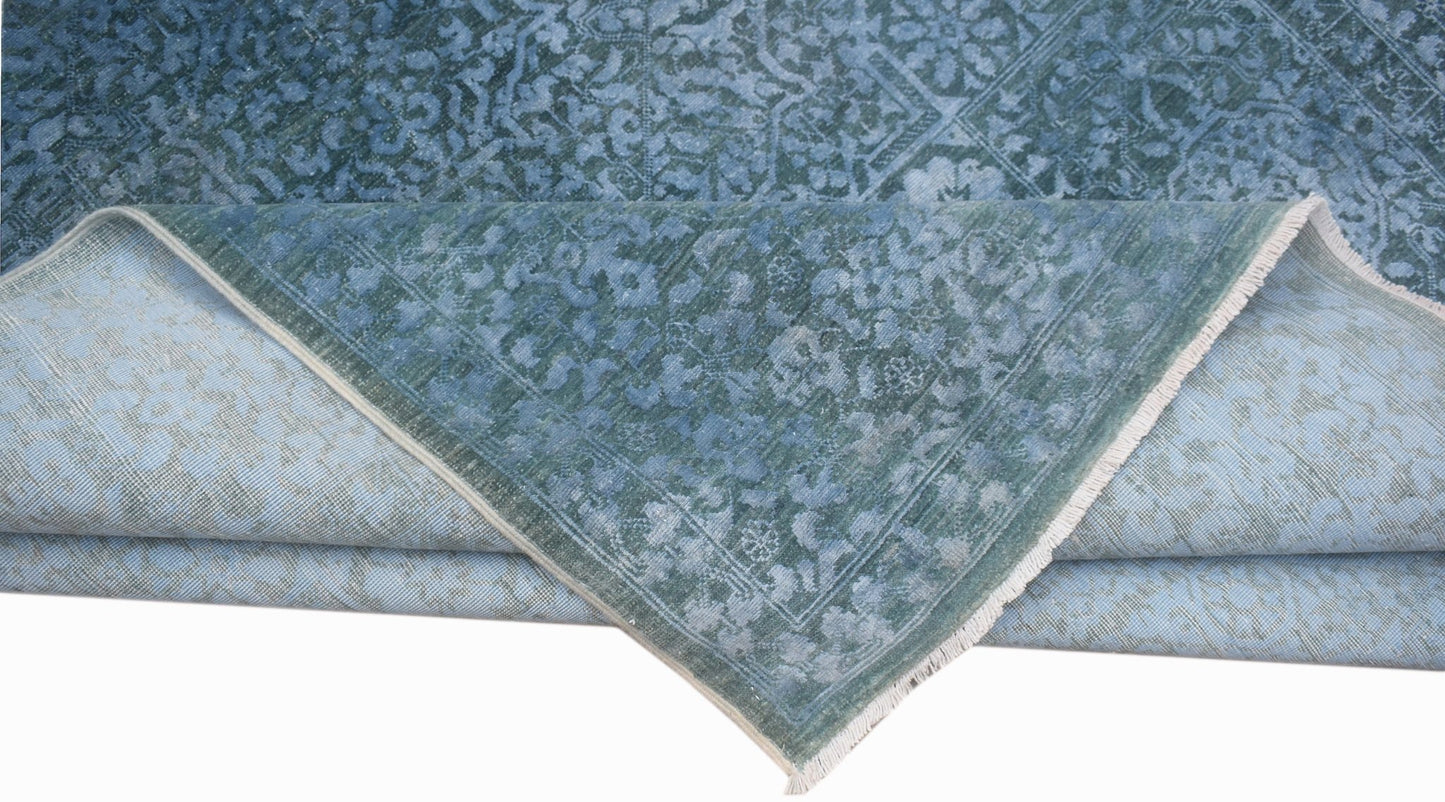 A handwoven Afghan Balkh rug in blue with a traditional Mamluk medallion pattern.