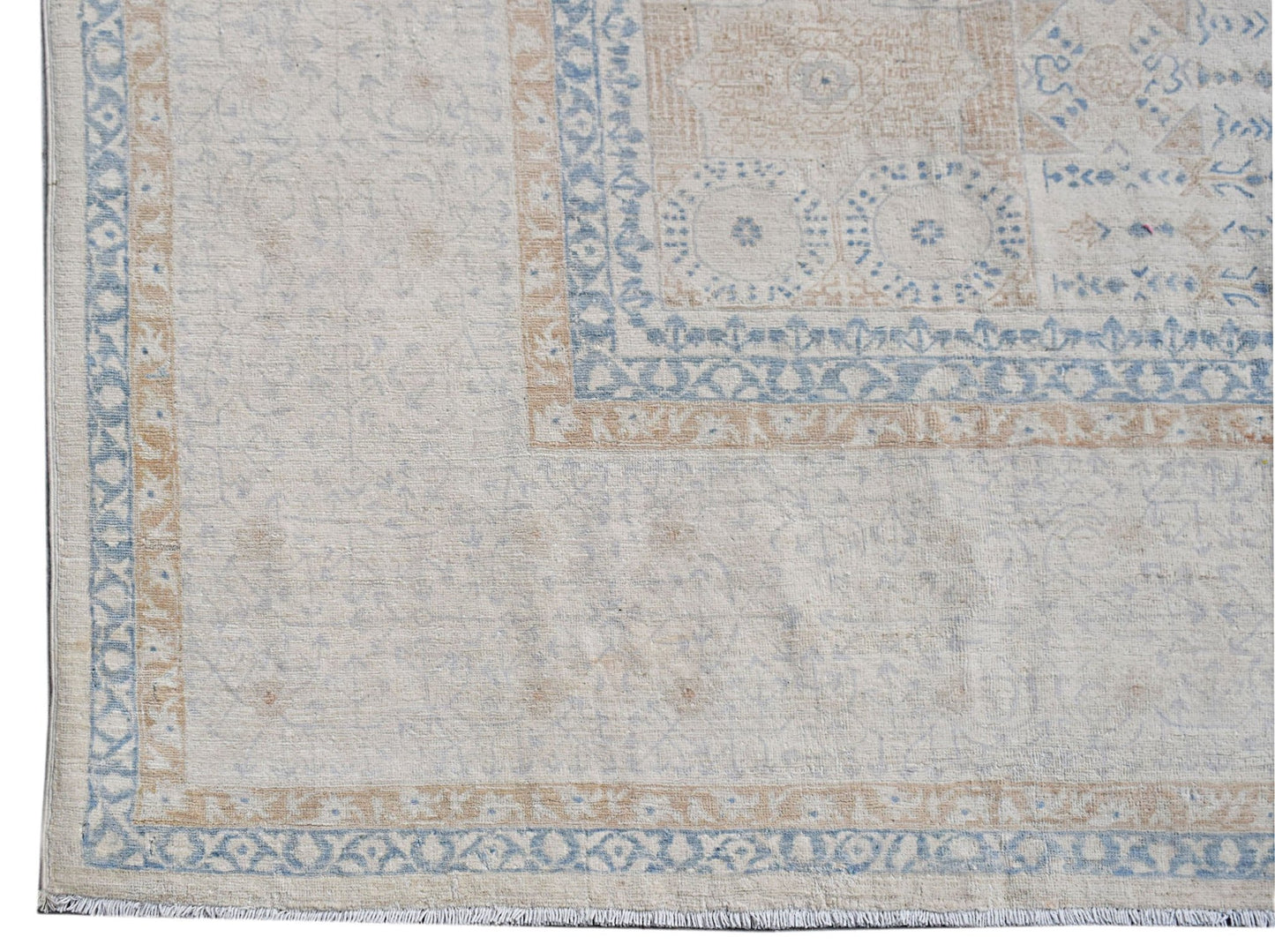 A handwoven Afghan Balkh rug featuring a traditional Mamluk pattern in soft blue and beige tones.