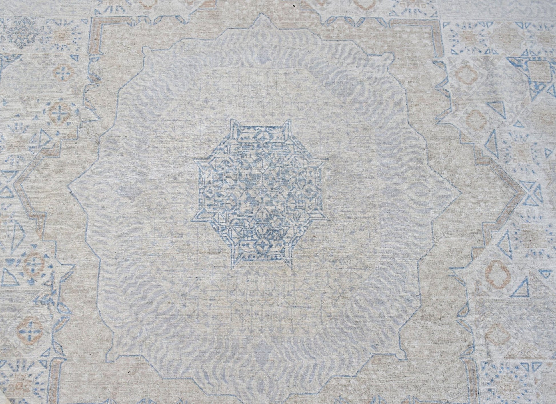 Handwoven Afghan Balkh rug featuring a detailed blue Mamluk medallion on a neutral wool background.