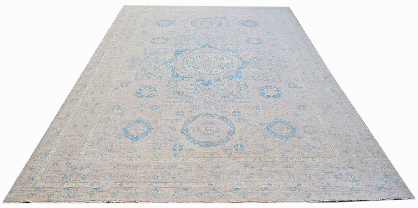 Handwoven Afghan Balkh rug featuring a traditional geometric pattern in soft blue and beige tones.