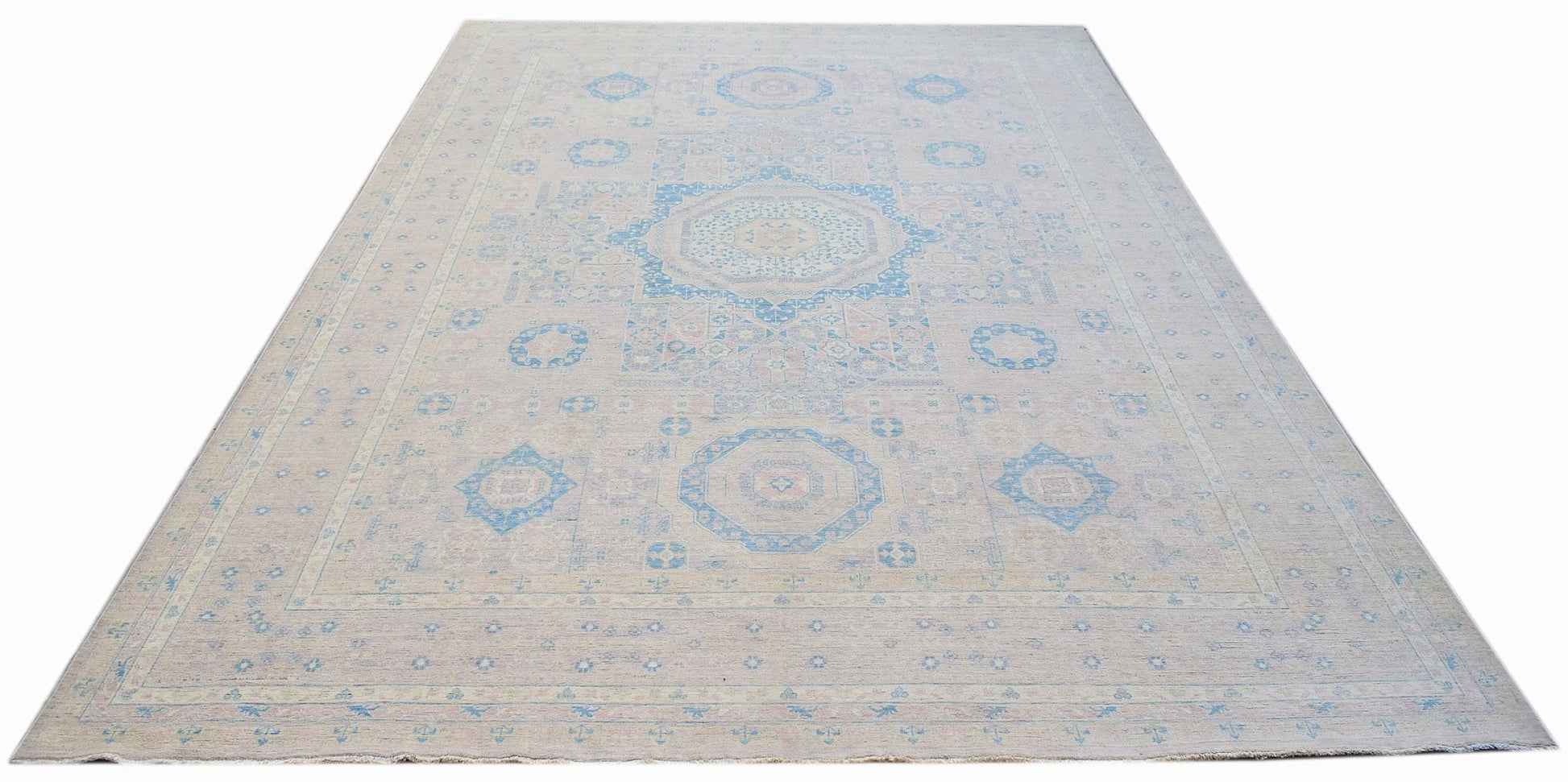 Handwoven Afghan Balkh rug featuring a traditional geometric pattern in soft blue and beige tones.